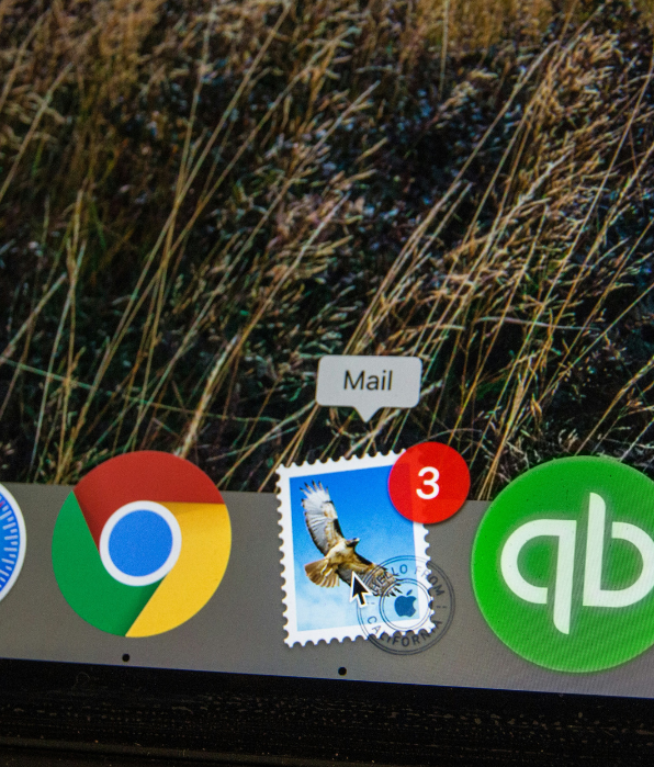 Depiction of an Apple dock showing the Apple Mail app icon along with others