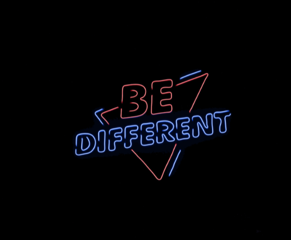 Neon sign that says, "Be Different"