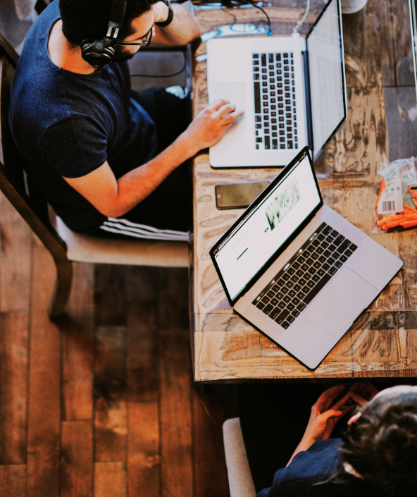 Coworking marketers working on their laptops